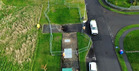 Car and pickup truck on road taken via drone shot from above