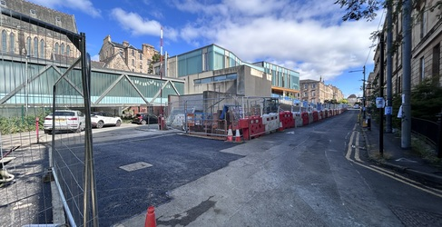 Newly laid tarmac on a road entrance to a school car park