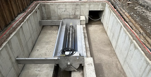 An underground chamber is shown on a construction site