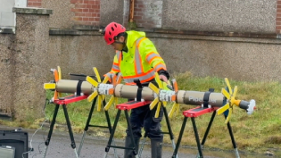 man standing with pipediver kit