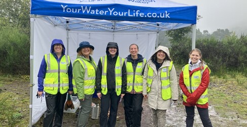 SW volunteers in Hi Vis at North Third Reservoir in front of a gazebo