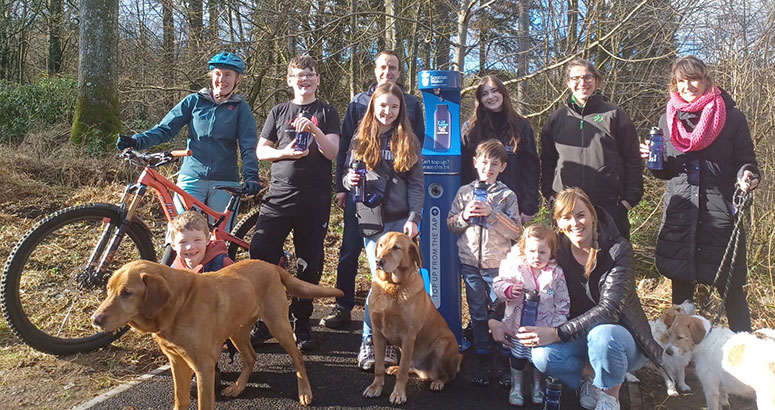 Group of people with bike and dogs