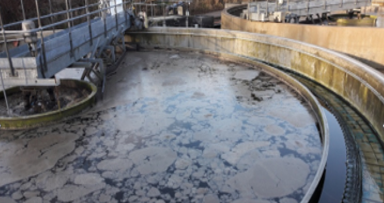 A settlement tank at Kemnay's Waste Water Treatment Works after being affected by unexplained variation in the incoming waste water that the site receives. The water at the top of the tank which would normally be clear shows a floating layer.