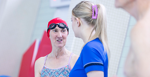 Learn to Swim instructor Lucy McCluskey talks to Dierdre Phoenix at her adult swim lesson