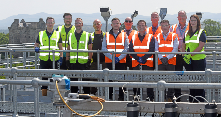 Medal winners, delivery partners and the operations team are pictured on the upper level of the WWTW. Niddry Castle is visible in the background