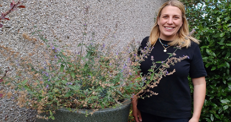Resident Katie Gibson with one of her new waterbutts