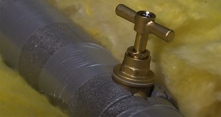 pipe with a tap joint lagged with insulation to prevent freezing